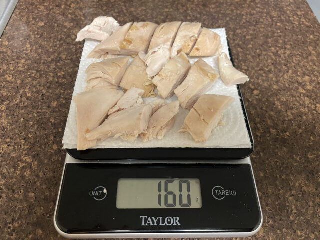 160g of cooked chicken Breast on a scale